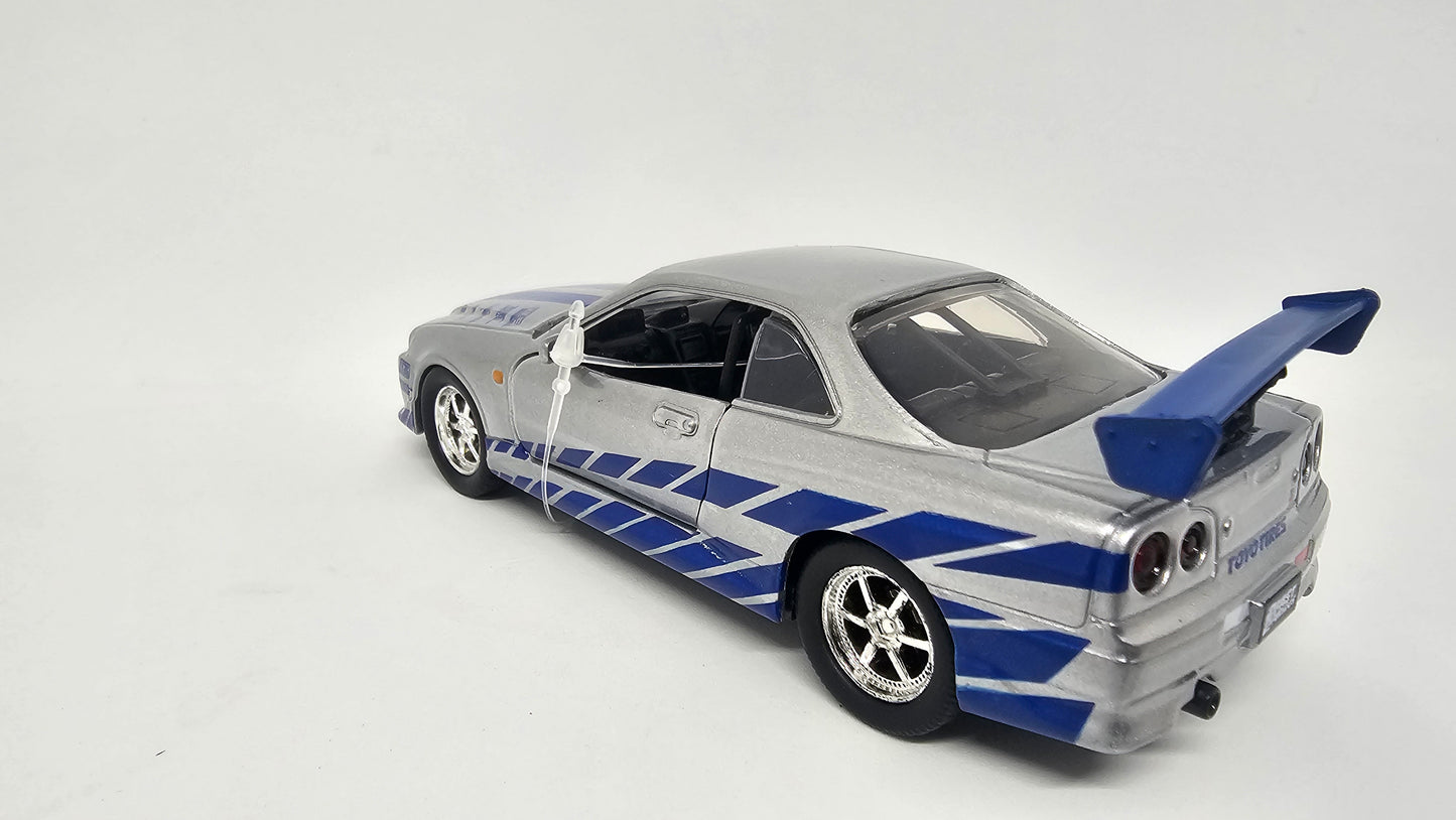 Nissan Skyline GT-R R34 de Brian - "RAPIDO Y FURIOSO 2" - Escala 1/32 - Jada