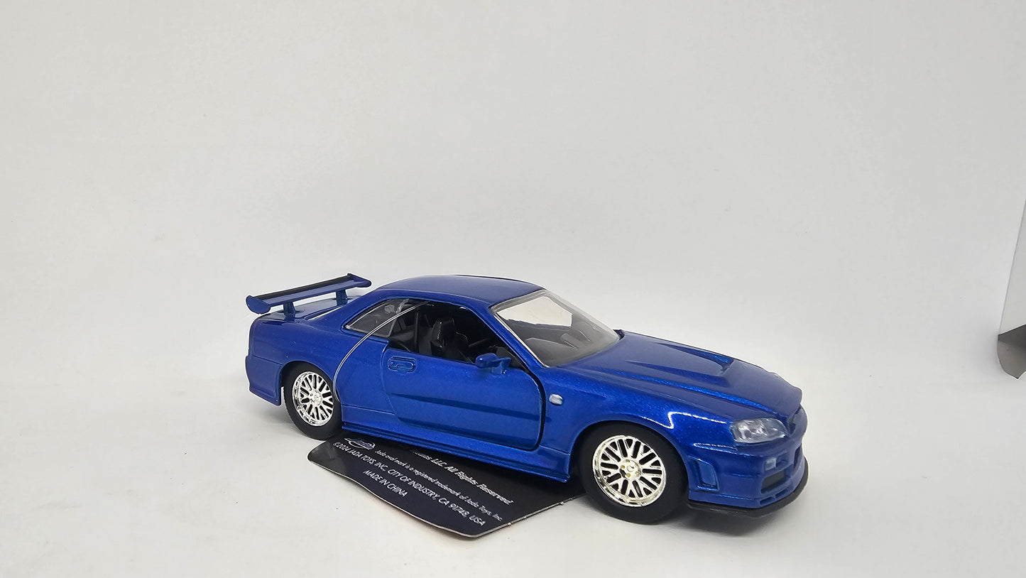 Nissan Skyline GT-R R34 2002 de Brian O´Conner - "RAPIDO Y FURIOSO" - Escala 1/32 - Jada
