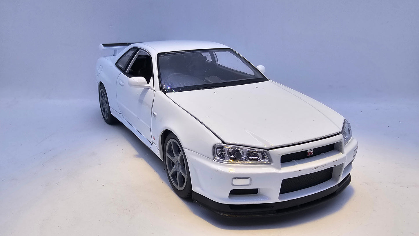 Nissan Skyline GT-R R34 - Escala 1/24 - Welly - (Sin caja)