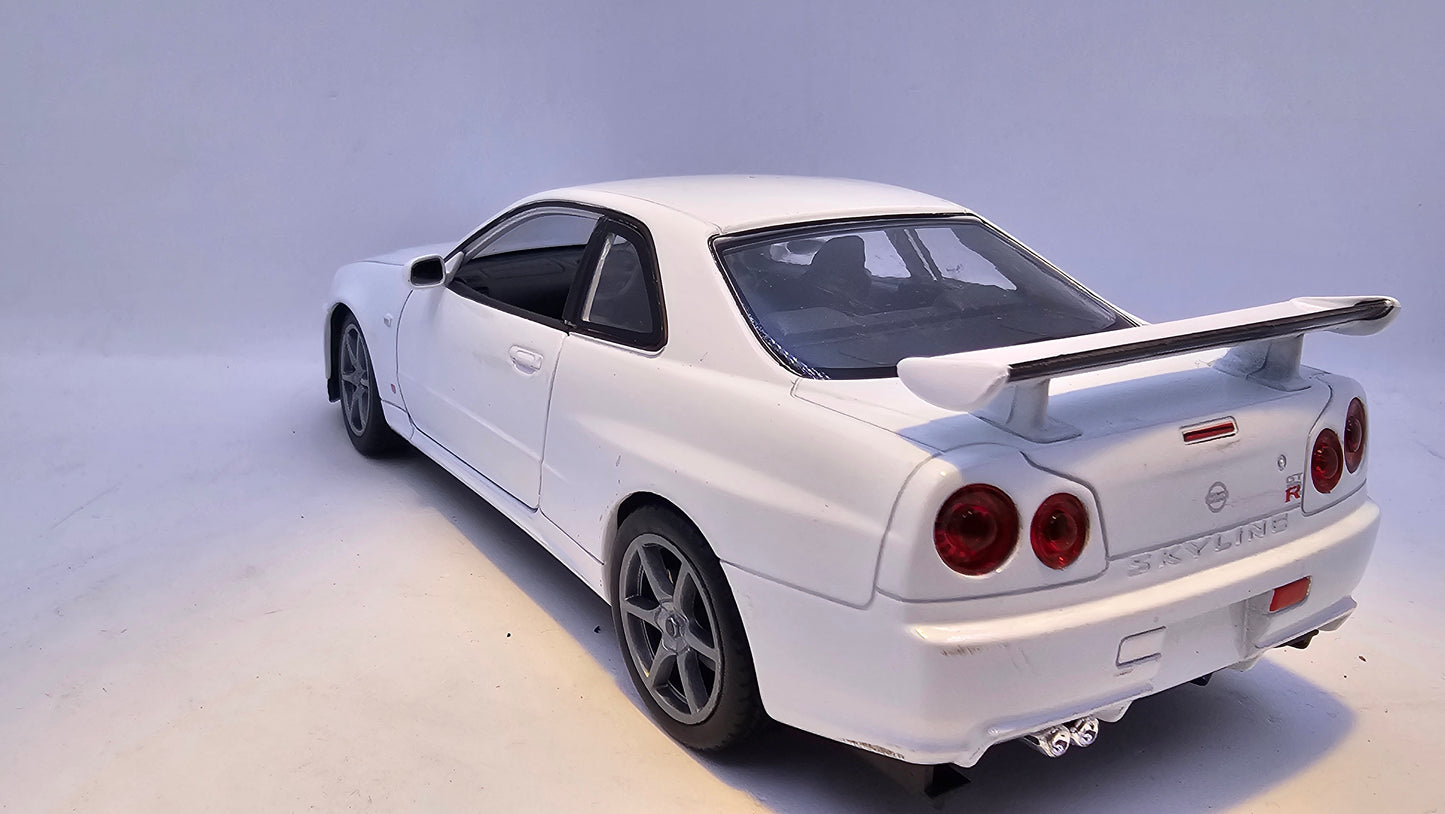 Nissan Skyline GT-R R34 - Escala 1/24 - Welly - (Sin caja)