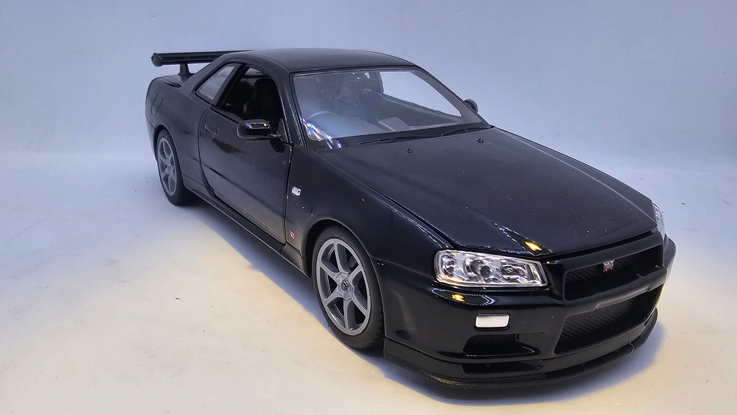 Nissan Skyline GT-R R34 - Escala 1/24 - Welly - (Sin caja)