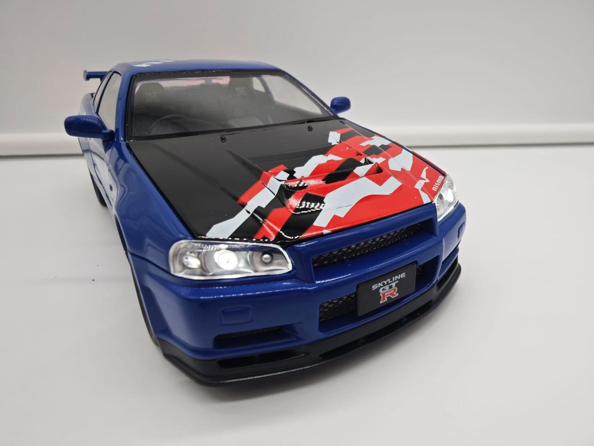 Nissan Skyline GT-R R34 Nismo - Escala 1/24 - c/Luz y Sonido - (sin caja)